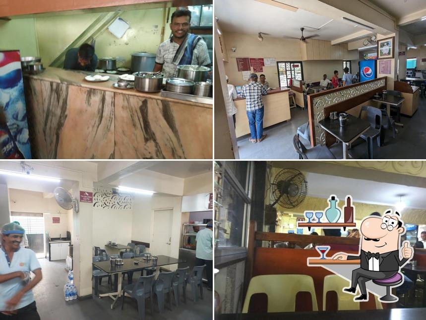 Take a seat at one of the tables at Sudha Idli Gruha (Upahar)