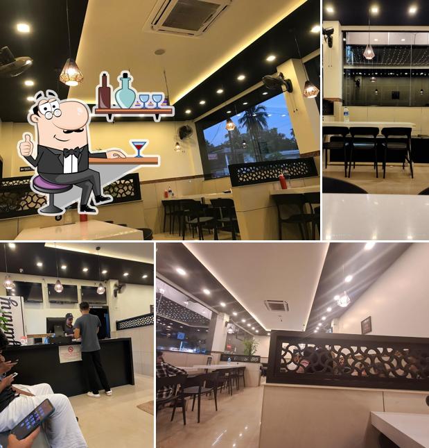 Take a seat at one of the tables at Yummy Fried Chicken, Kondotty