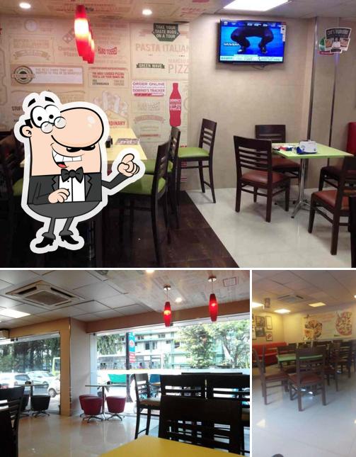 The picture of Domino's Pizza’s interior and dining table