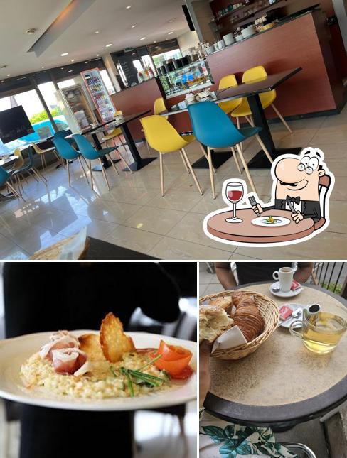 Questa è la immagine che presenta la cibo e interni di Zio by Prestige Gourmand Perly