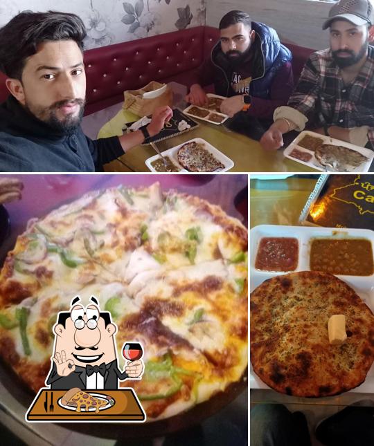 Pick pizza at Punjab Cafe