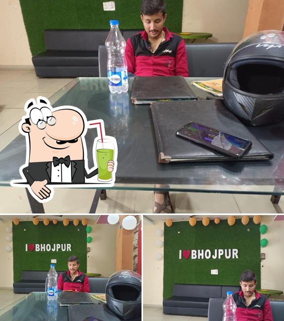 Enjoy a beverage at Bhoj cafe-Restaurant & Hotel