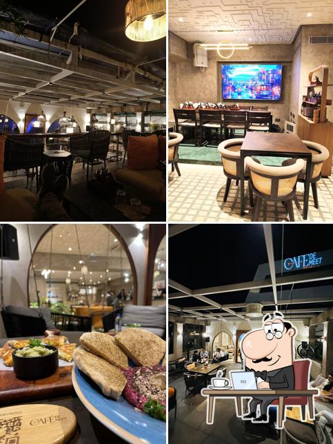 Take a seat at one of the tables at Cafe De Meet