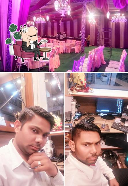 Take a seat at one of the tables at Hotel Guru Kripa