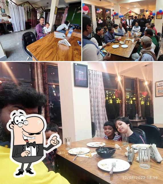 Take a seat at one of the tables at Basil Cafe and Restaurant