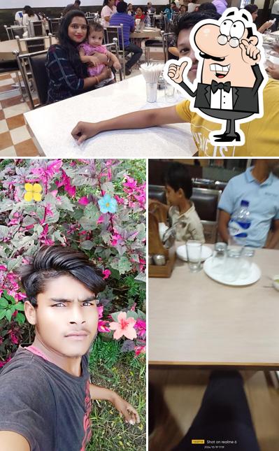 Take a seat at one of the tables at Loveena Restaurant