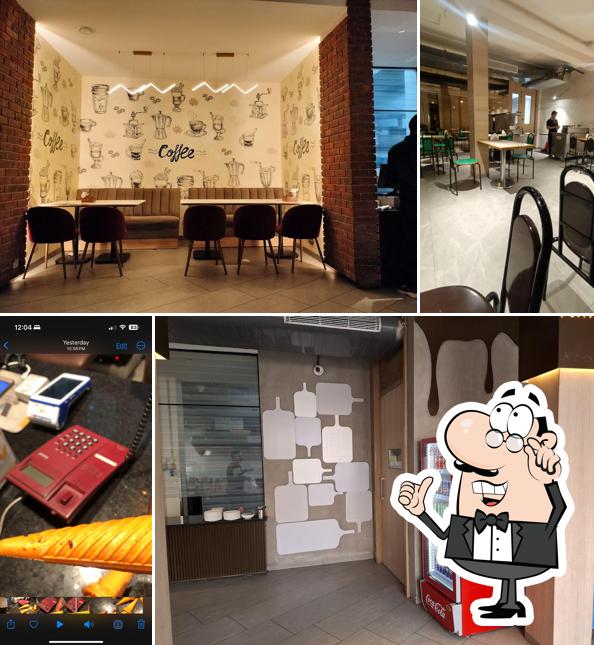 Take a seat at one of the tables at Anil's Fast Food & Ice Cream