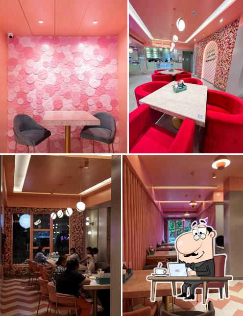 Take a seat at one of the tables at Pinkk Sugars- The Modern Bistro