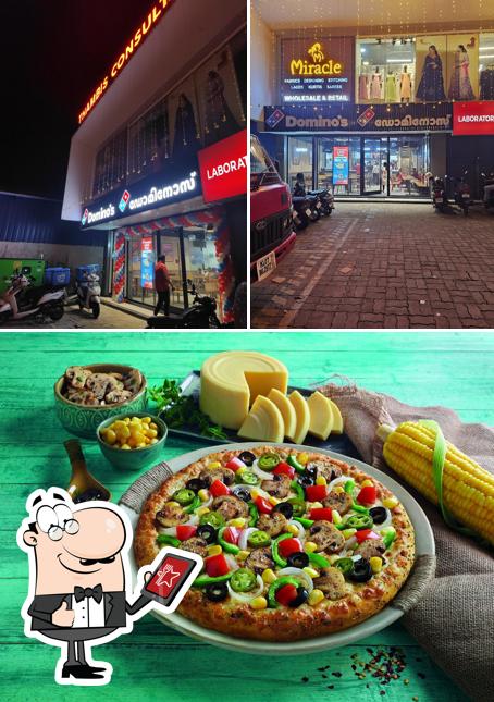 Take a look at the photo showing exterior and food at Domino's Pizza North Paravur, Ernakulam