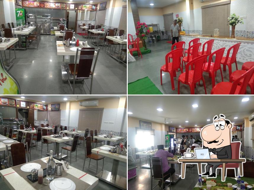 Take a seat at one of the tables at Balaji Restaurant