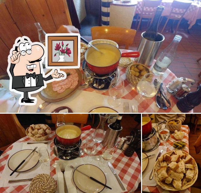 Dai un’occhiata alla foto che mostra la interni e bevanda di Raclette Stube