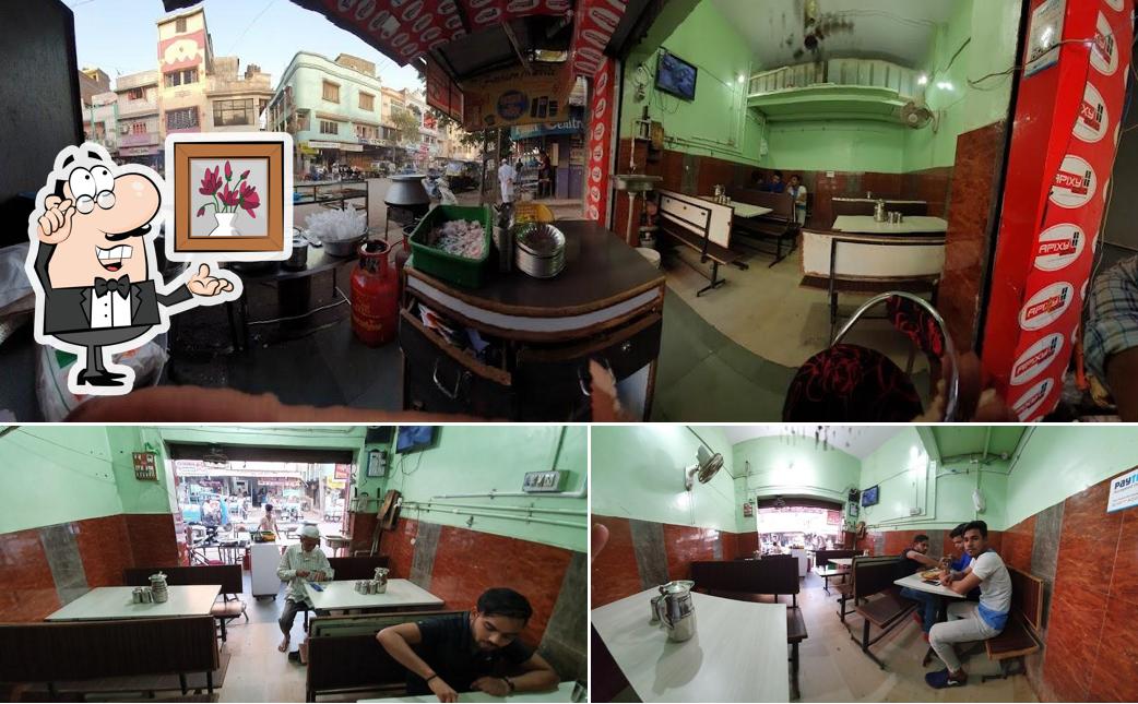 Take a seat at one of the tables at Raja Chicken