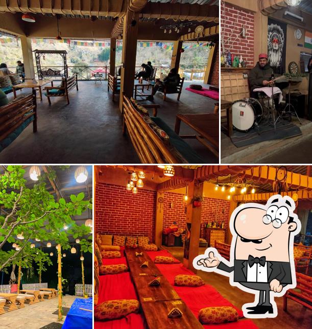 Take a seat at one of the tables at Mazel Tov Hostel & Café