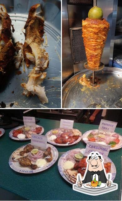 Take a look at the photo showing food and interior at Arabian hut