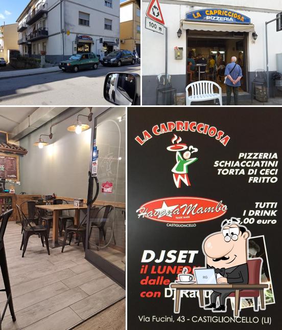 Siediti a un tavolo di Pizzeria La Capricciosa Pizza al Taglio e da Asporto