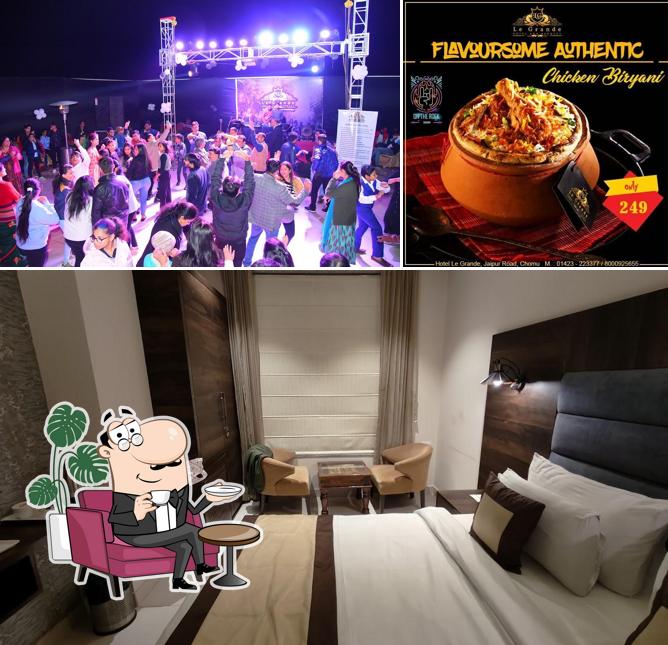 Take a seat at one of the tables at Hotel Le Grande