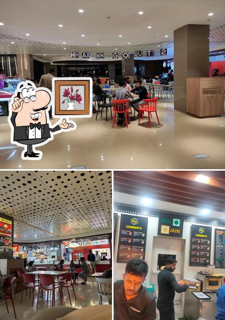 Take a seat at one of the tables at Cafe Bollywood कॅफे बॉलिवूड