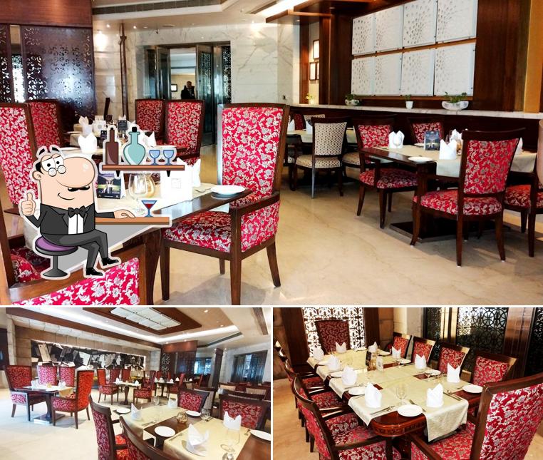 Take a seat at one of the tables at Raajsik - Indian Cuisine Restaurant