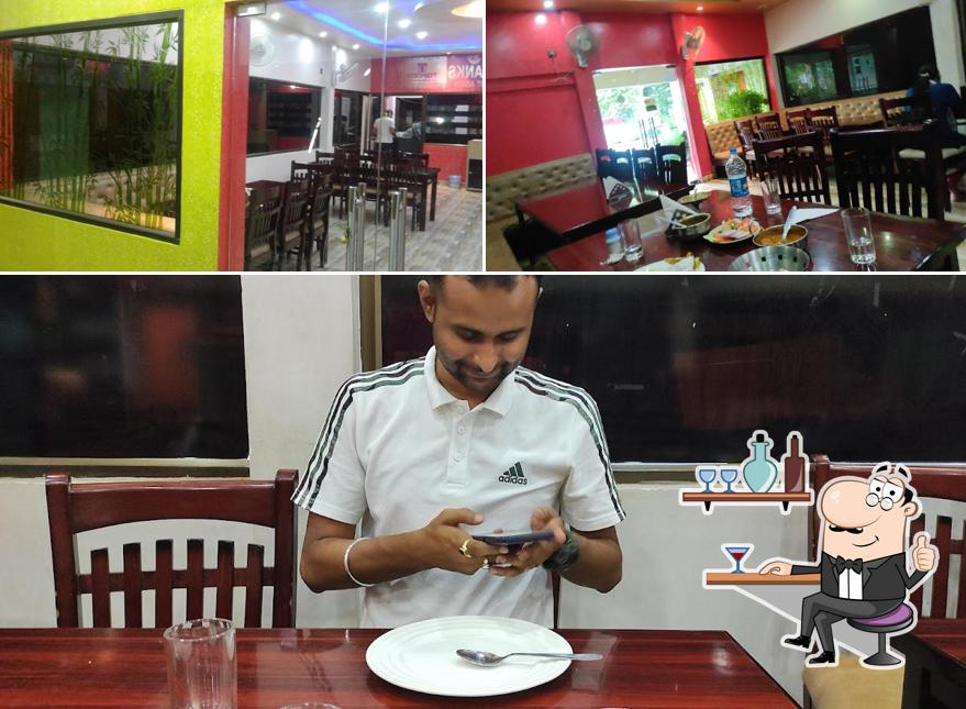 Take a seat at one of the tables at Whistling Woods Dhaba