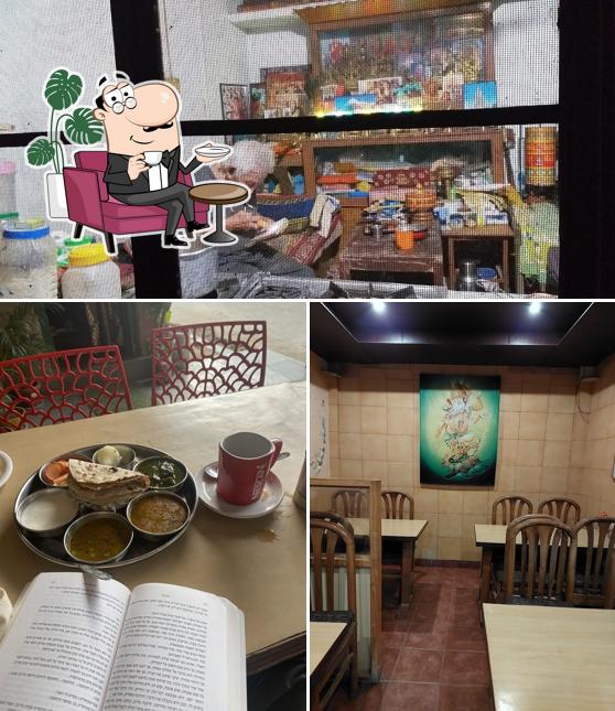 Take a seat at one of the tables at Kora Cafe