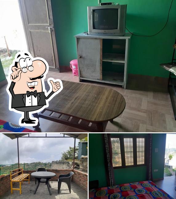 Take a seat at one of the tables at Suhani Rooms & Restaurant