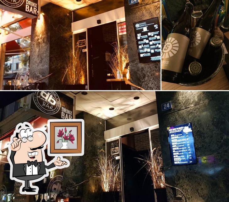 Questa è la foto che mostra la interni e alcol di Drinx Bar db