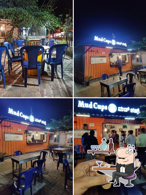Take a seat at one of the tables at MudCups - Anekal