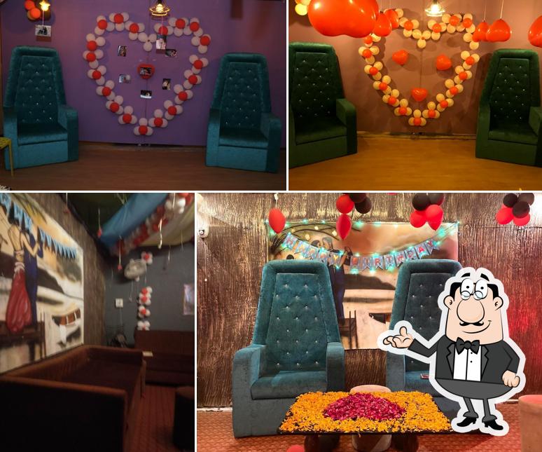 Take a seat at one of the tables at Click Cafe Studio & Family Restaurant