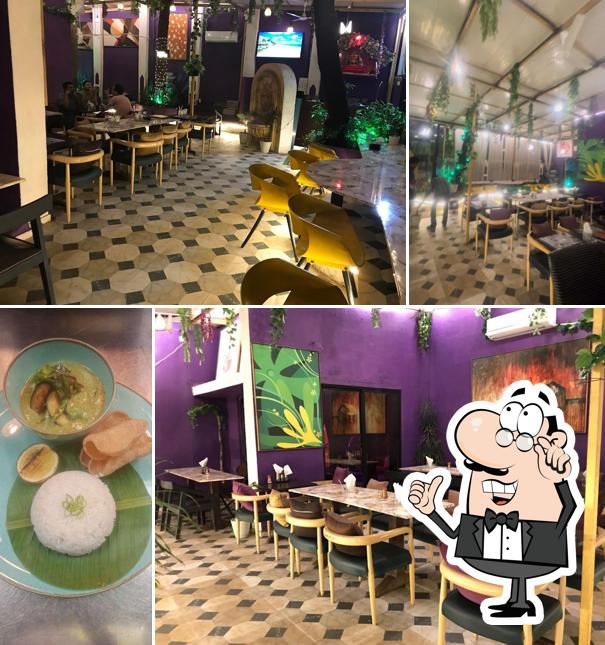 Take a seat at one of the tables at Lubss Cafe Veg. & Jain Juhu