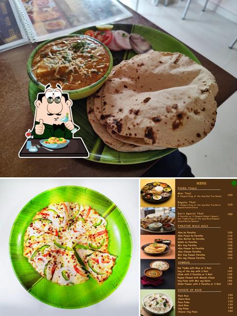 Take a look at the image displaying food and interior at Dev's Kitchen