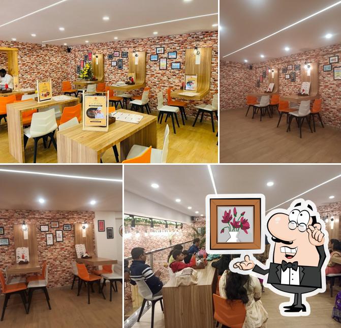 Take a seat at one of the tables at 7th Heaven Ahmednagar