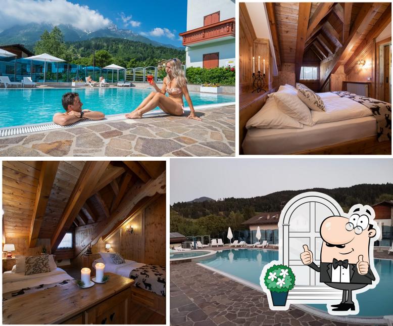 Puoi goderti l'aria fresca da seduto all'esterno di HOTEL ALPENROSE ristorante SPA