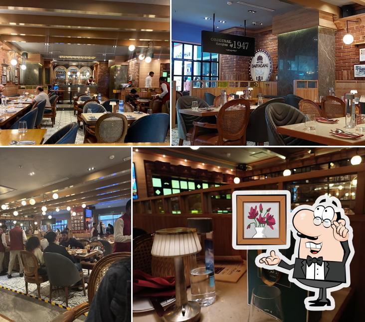 Take a seat at one of the tables at Daryaganj Restaurant