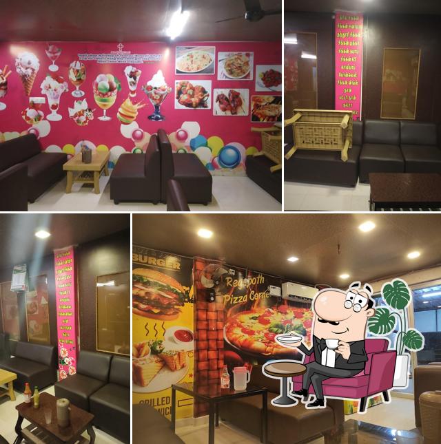 The interior of REHOBOTH Briyani Juice & Pizza A/C