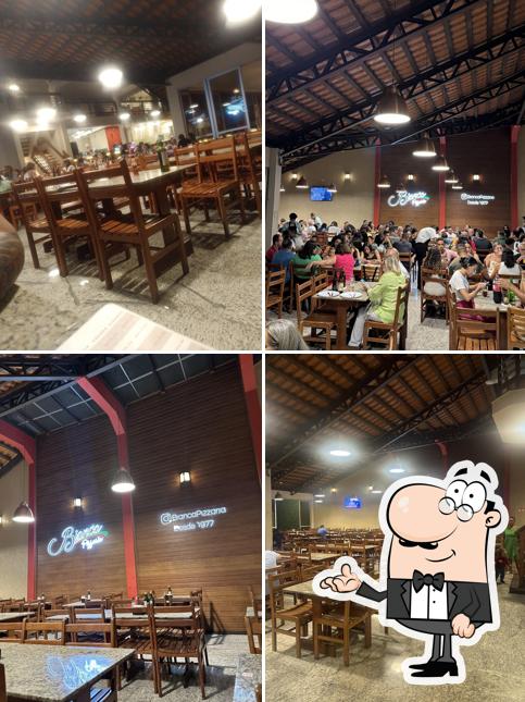 Sente em uma das mesas no Pizzaria Bianca - Restaurante e Pizzaria - Desde 1977