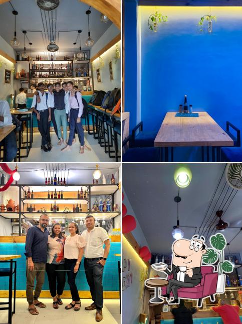 Take a seat at one of the tables at CookEr's Eatery best cafe in varachha