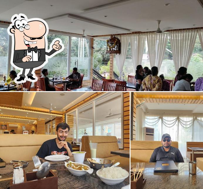 Take a seat at one of the tables at Navaratna Udupi Pure Veg Restaurant