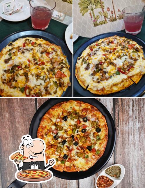 Try out pizza at Veggie Delight Goa