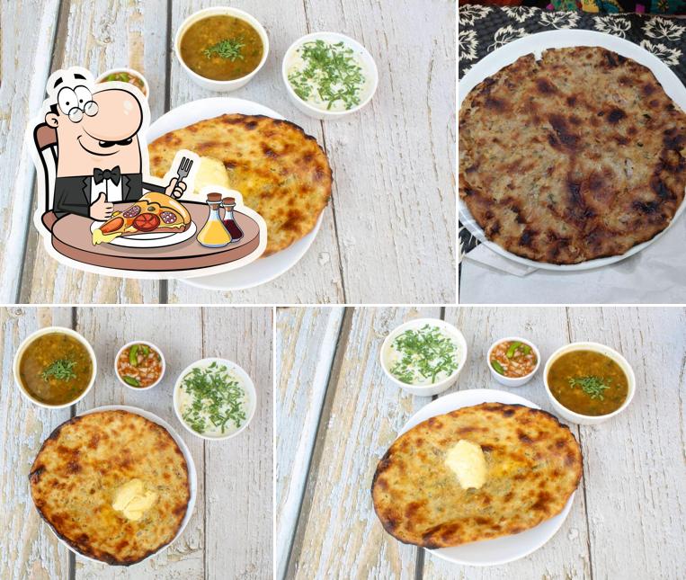 Try out pizza at Kulcha Kingdom & Punjabi Dhaba