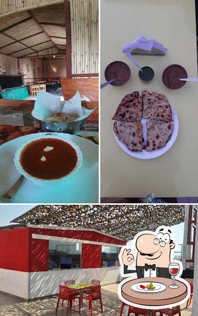 Check out the photo depicting food and interior at Kartoos 1857