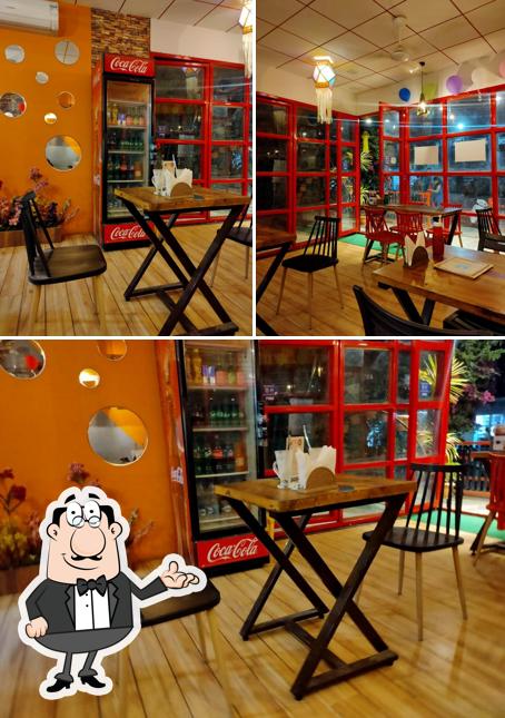 Take a seat at one of the tables at Frost & Feather