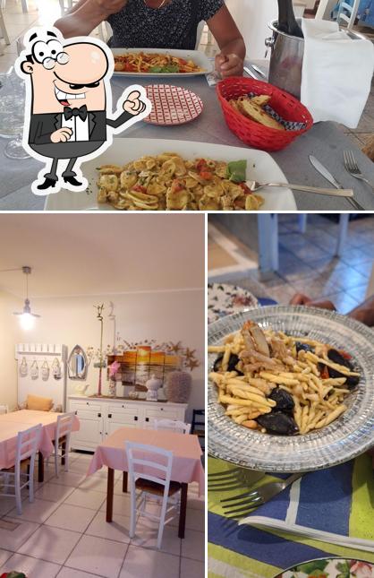 La interni e tavolo da pranzo del ristorante