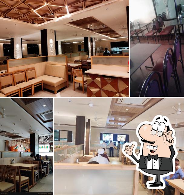 Take a seat at one of the tables at Harsha Family Restaurant