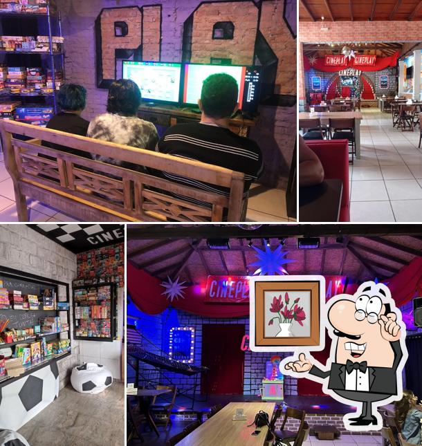Sente em uma das mesas no Cineplay- Restaurante e Jogos