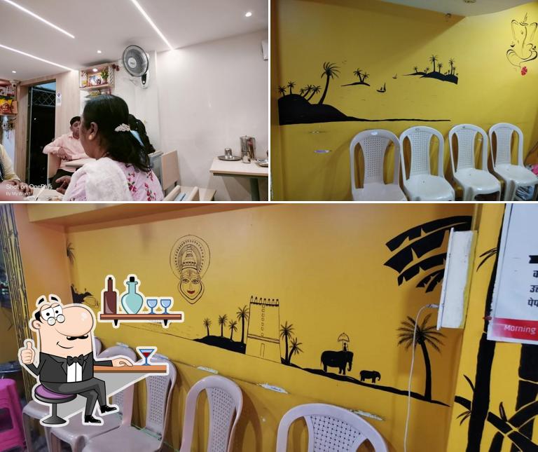 Take a seat at one of the tables at Shri Sai Dosa Center