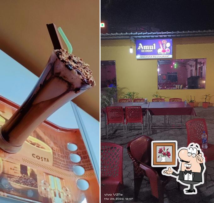 Take a seat at one of the tables at Vrindavan Family Restaurant