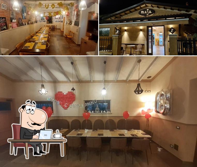 Dai un'occhiata agli interni di MAJA Caffé Pizzeria Dai un'occhiata agli interni di MAJA Caffé Pizzeria