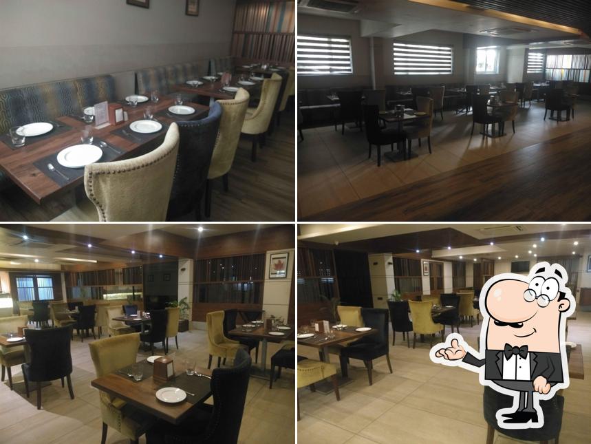 Take a seat at one of the tables at Mantra Fine Dine