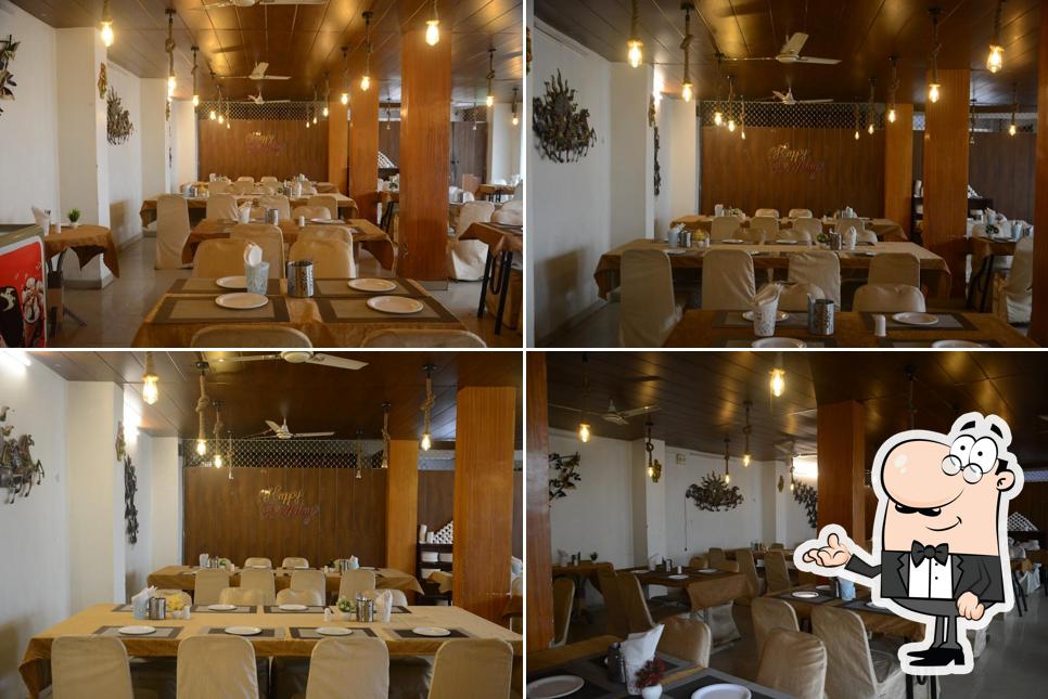 Take a seat at one of the tables at Mohan's sunrise family Restaurant