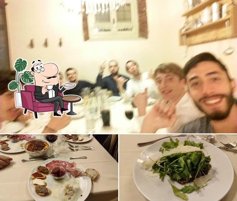 Questa è la immagine che raffigura la interni e cibo di Trattoria Paccì